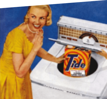 A smiling woman using Tide powder detergent in a top-loading washing machine in 1946