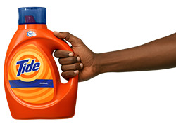 A person holding a Tide Original Liquid Detergent product