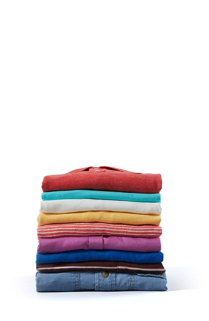 Stack Of Neatly Folded Colorful Kitchen Towels, On White