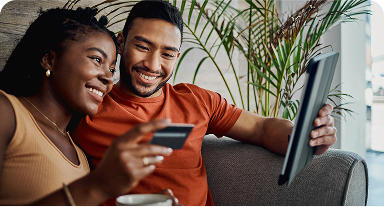 A couple reading and smiling