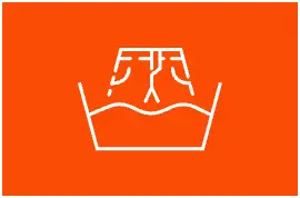A pictogram of a pair of jeans being soaked in a bucket of water