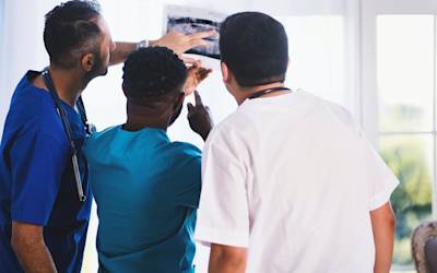 doctors looking at X-ray