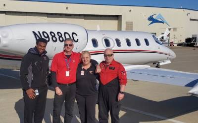 crew in front of plane