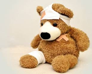 teddy bear dressed as patient