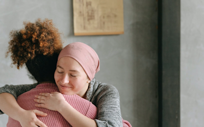 cancer patient getting a hug