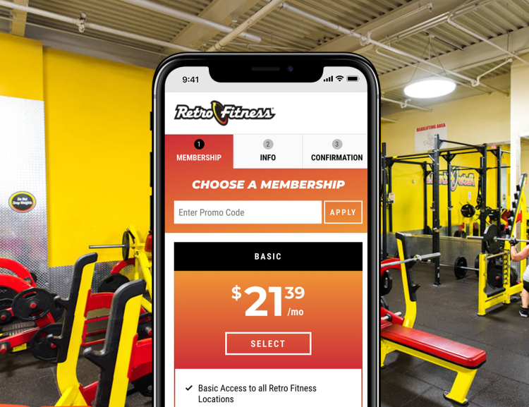 Retro Fitness website shown on mobile device with work out equipment in the background