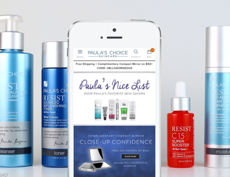 Paula's Choice website shown on mobile device with skincare products in the background