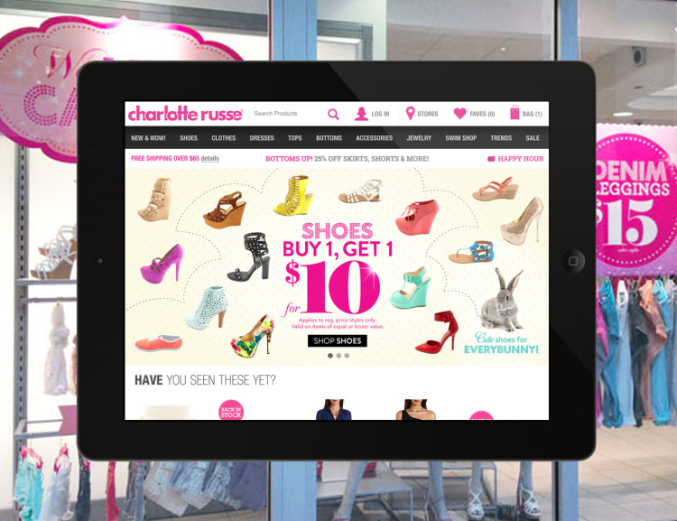 Charlotte Russe website shown on tablet device with merchandise in the background