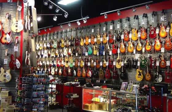 Guitar wall in a Sam Ash store