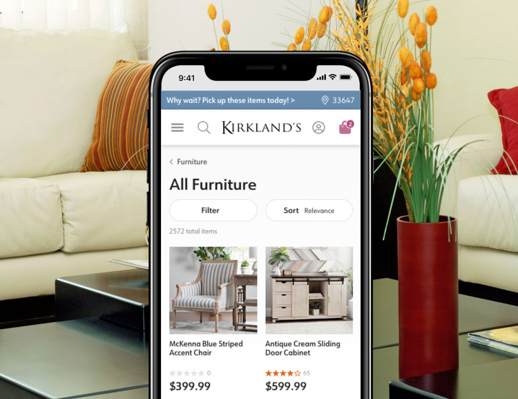 Kirklands website shown on mobile device with living room background