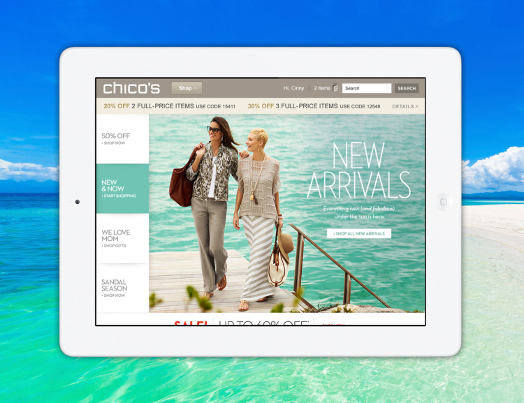Chicos website shown on tablet device with the beach in the background