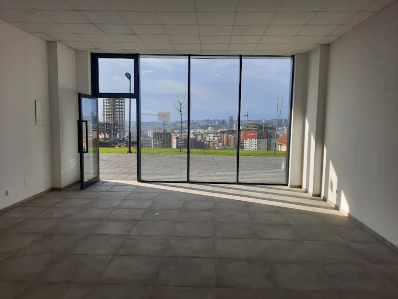 Commercial space of 75.6 m² for sale in Veternik, featuring a beautiful view of Prishtina. The space is suitable for various business activities. - Image 1