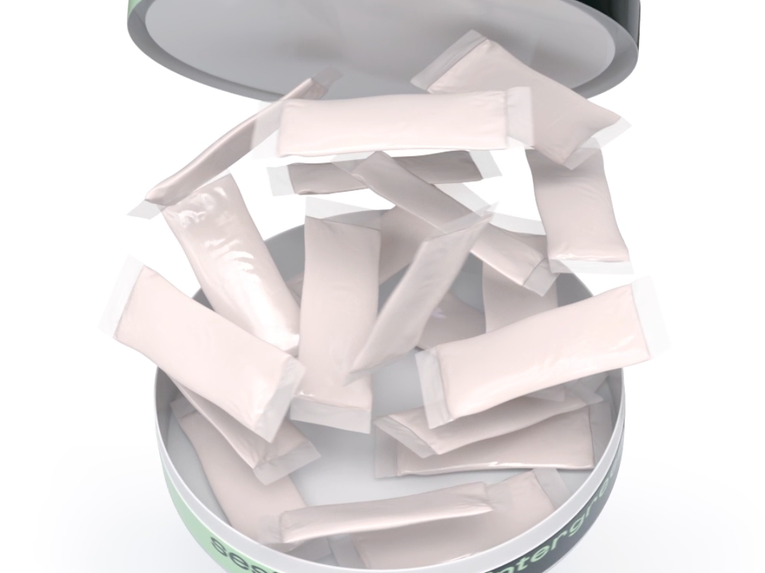 An image of a round tin full of nicotine pouches. The tin is open and the pouches appear to be flying into the air. 