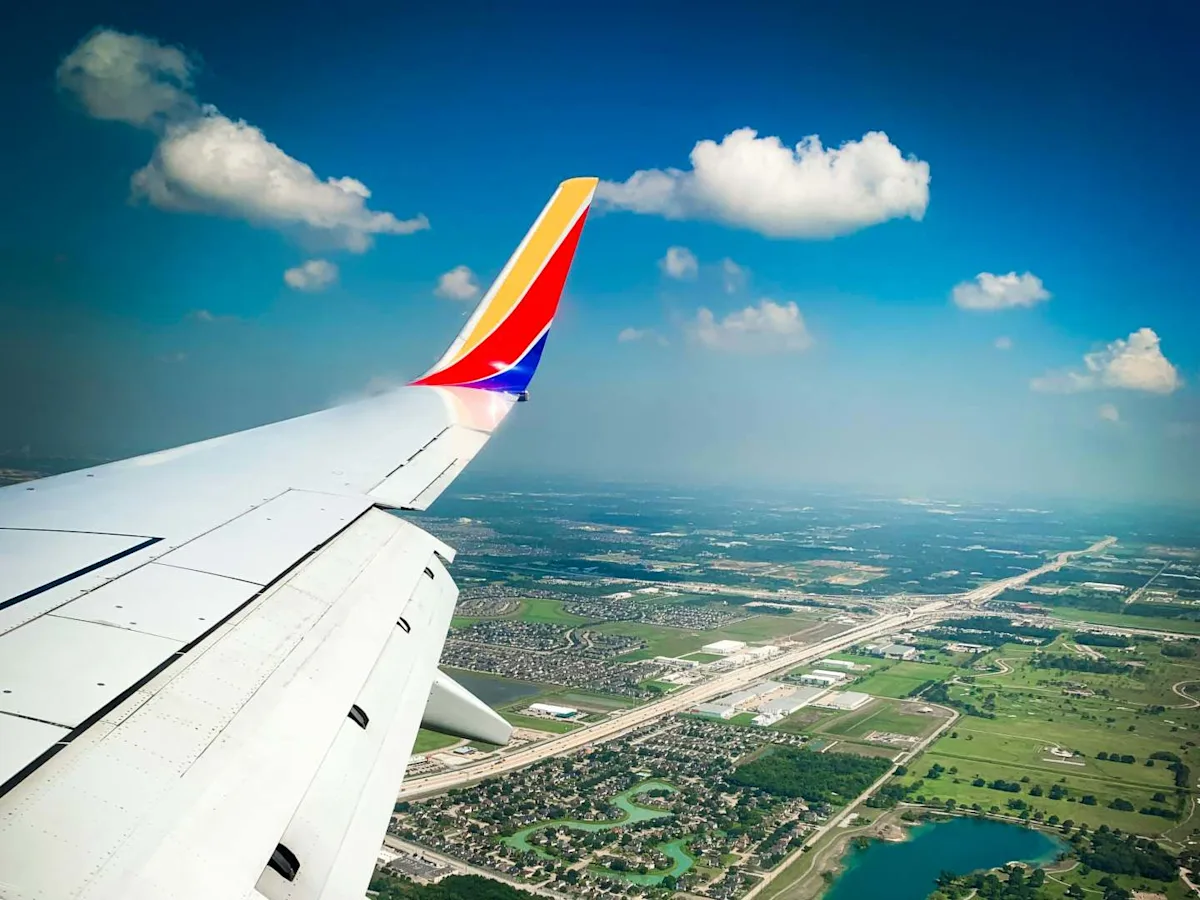 A Southwest aircraft with a Citi card, illustrating the challenge of using Citi ThankYou Points on Southwest.