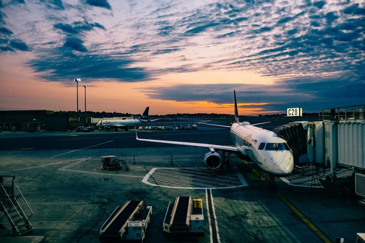Points routed to an airline or a bank portal, illustrating when to redeem each way.