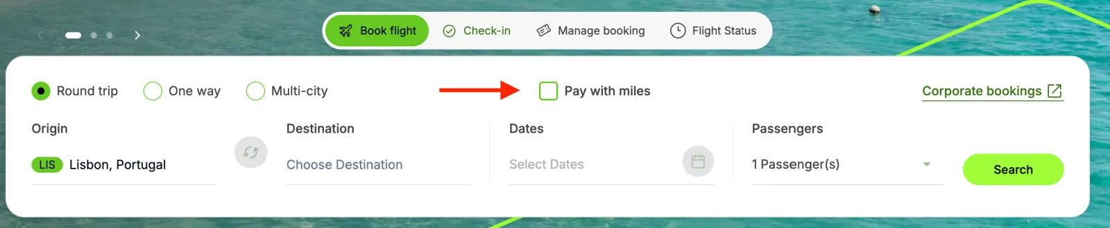 Screenshot of the TAP Air Portugal Miles&Go booking page with the 'Pay with Miles' checkbox highlighted by a red arrow.