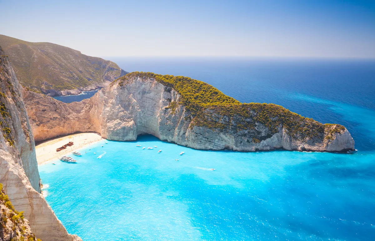 A scenic European coastline in summer, illustrating how to book an affordable Eurotrip using points.