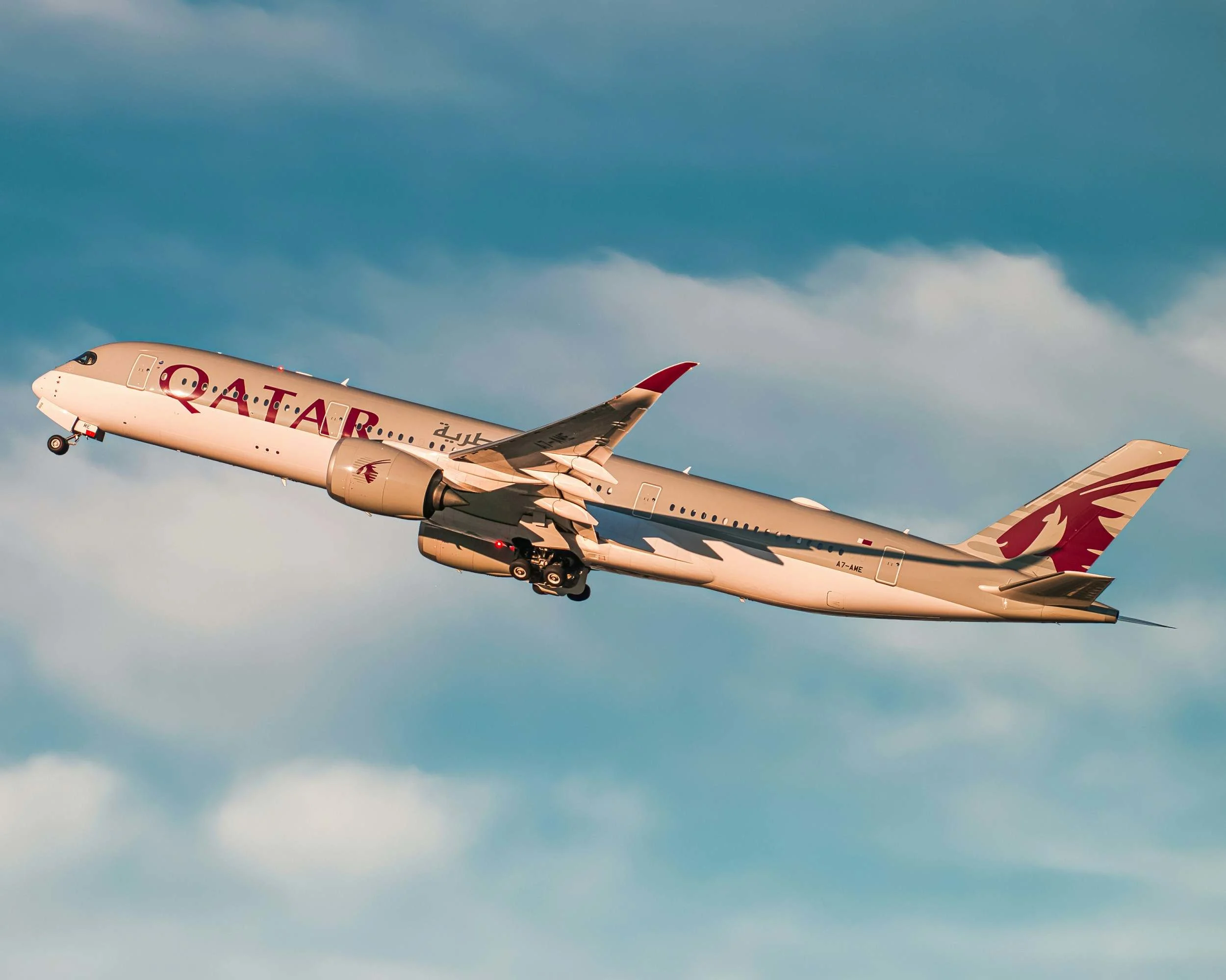 A Qatar Airways Qsuite business class seat, illustrating point.me's Qatar Airways Privilege Club and business class guides.