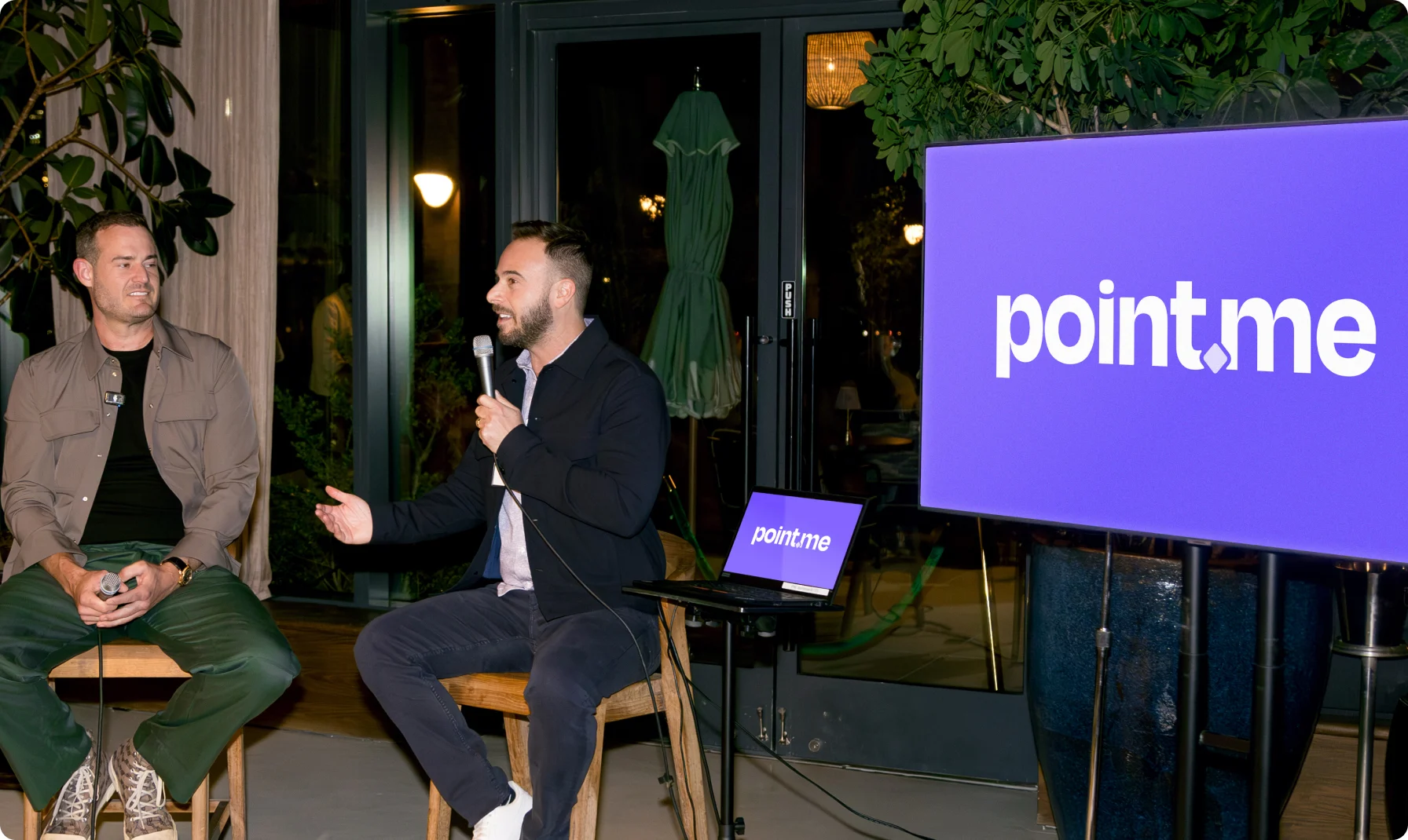 Adam Morvitz, CEO and founder of point.me, appearing with Brian Kelly, The Points Guy, talking to an audience of investors and media about point.me