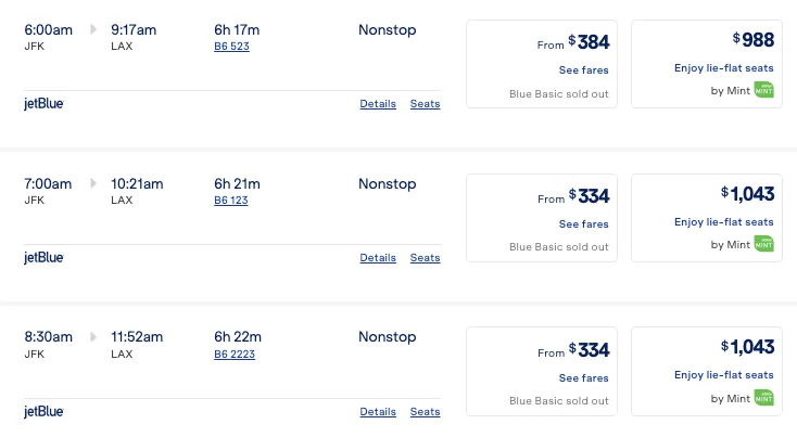 Screenshot of the same JetBlue JFK to Los Angeles flights priced in dollars, with Mint fares ranging from $988 to $1,043.