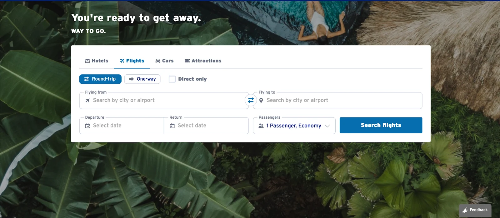 Capital One Travel homepage flight search panel displayed over an aerial photo of a tropical pool
