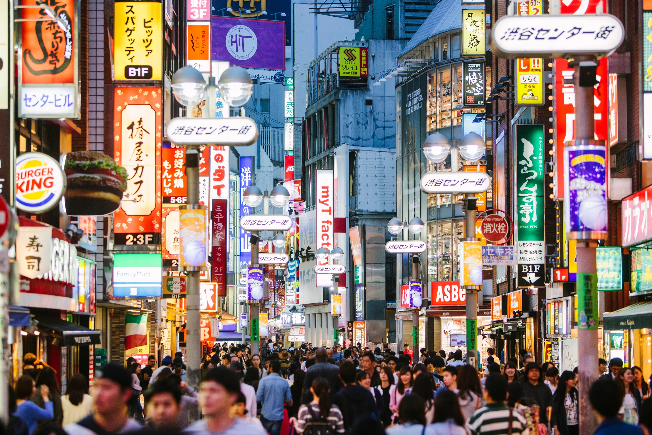 A Tokyo cityscape at night, illustrating a guide to the city's best hotels and restaurants.