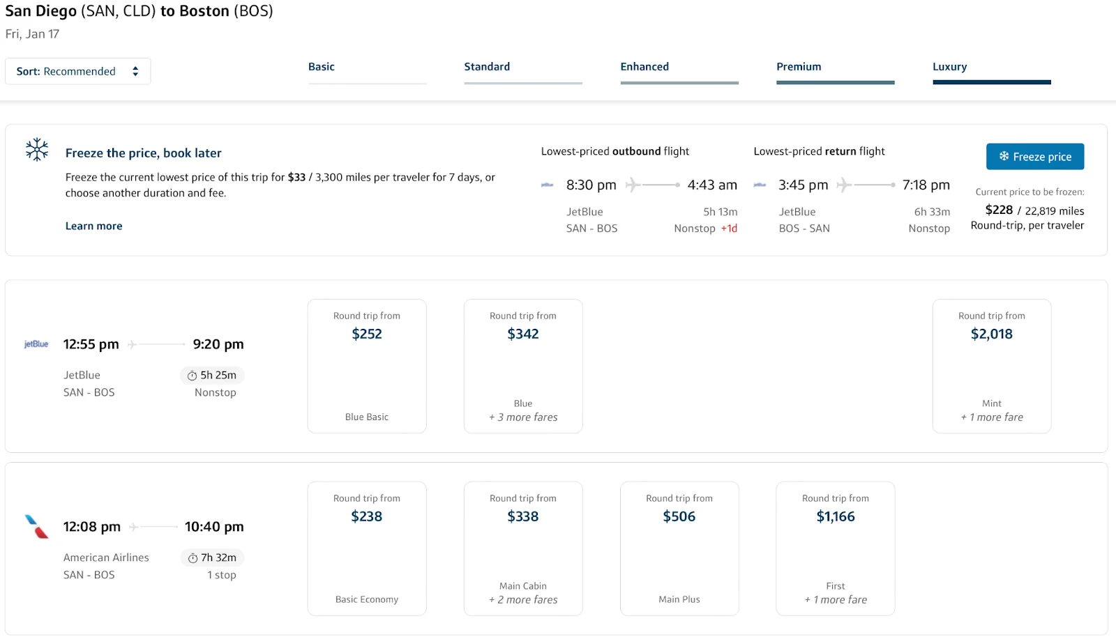 Screenshot of Capital One Travel search results for San Diego to Boston showing fares across Basic, Standard, Enhanced, Premium, and Luxury tiers, with a price-freeze option