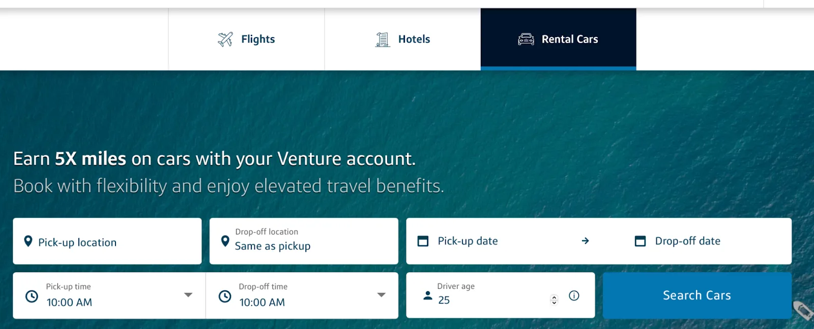 Screenshot of the Capital One Travel homepage on the Rental Cars tab with a car search bar