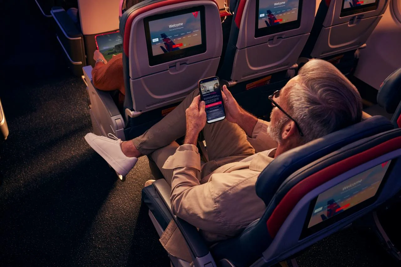 A Delta Comfort+ cabin with extra legroom, illustrating the upgraded economy experience.