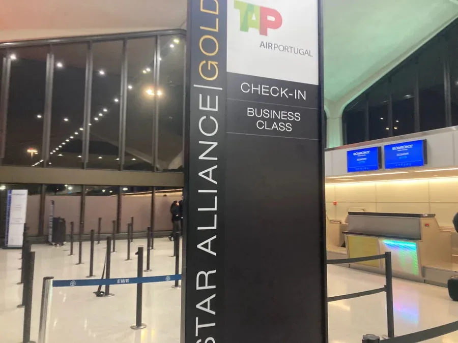 TAP Air Portugal Star Alliance Gold business class check-in sign at Newark Liberty International Airport