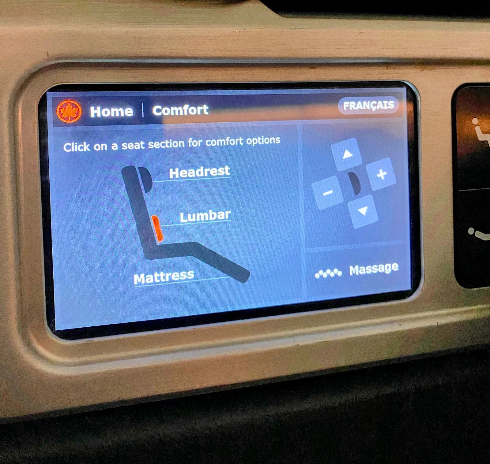Air Canada business class seat touchscreen showing comfort controls for headrest, lumbar support, mattress firmness, and massage.