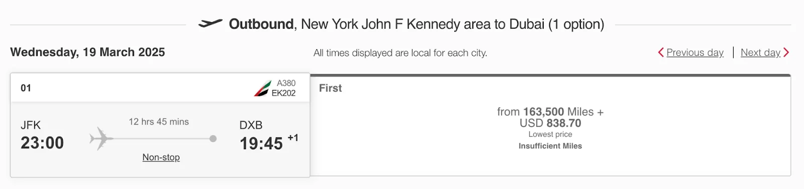 Screenshot of an Emirates award search showing a New York JFK to Dubai first class flight priced at 163,500 miles plus $838.70