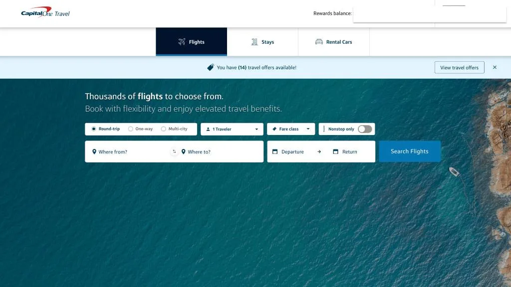 Capital One Travel homepage flight search panel displayed over an aerial photo of the ocean