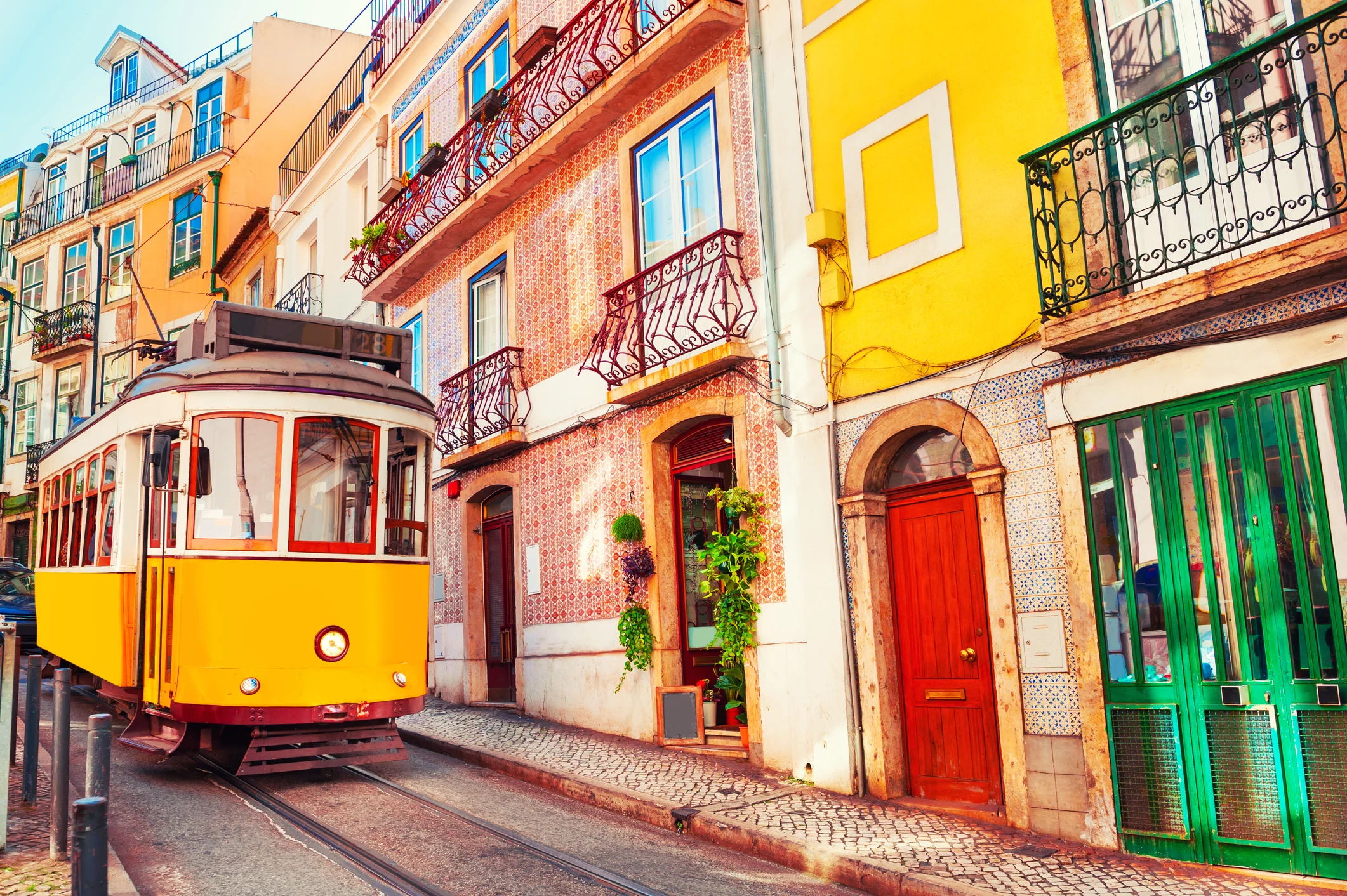 Lisbon's colorful hillside streets, illustrating a guide to the best of Lisbon and Portugal.
