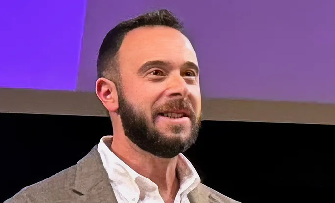 Adam Morvitz, Founder and CEO of point.me, speaking at a conference.