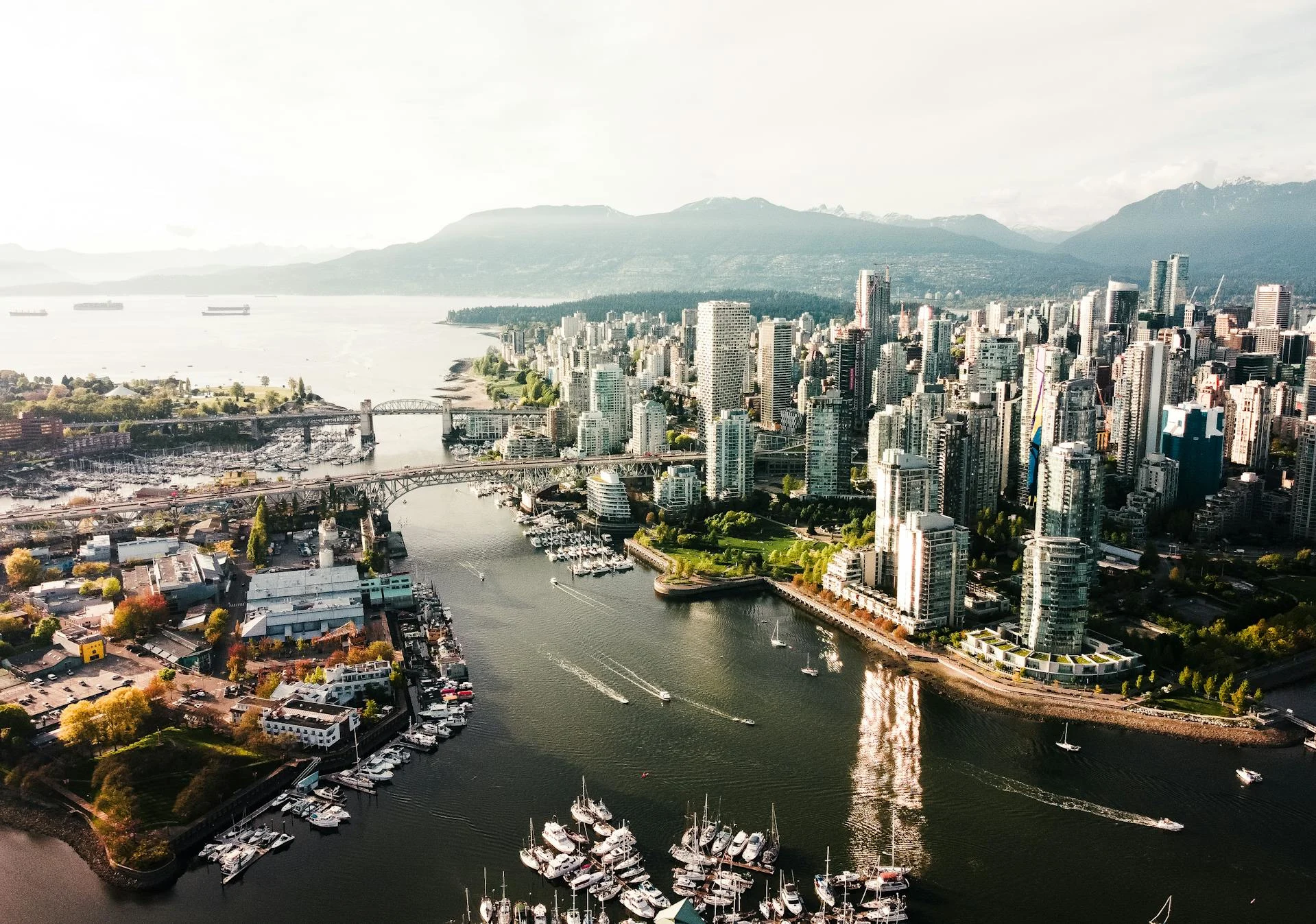 Vancouver's skyline against the mountains, illustrating a guide to the city's food and attractions.