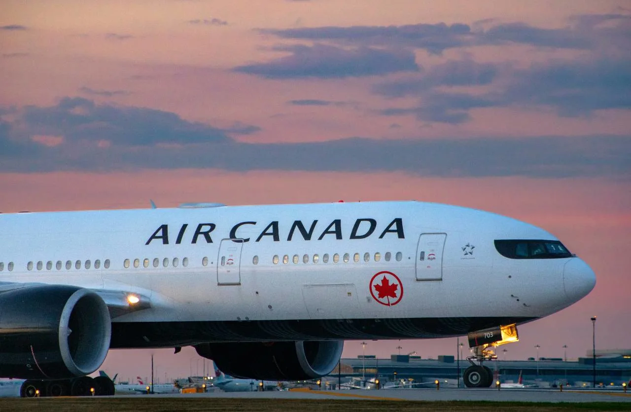 An Air Canada aircraft in flight, illustrating Aeroplan partner airlines and sweet-spot award redemptions.