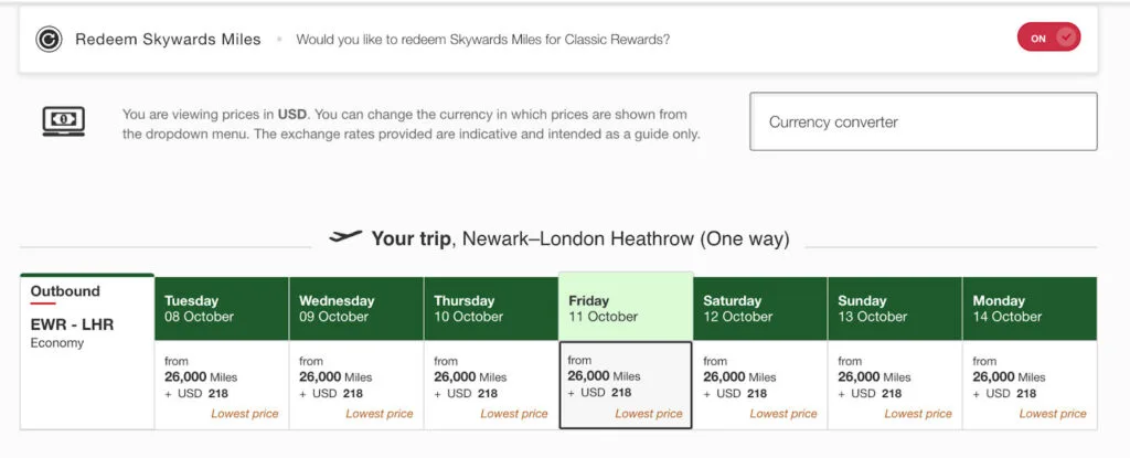 Screenshot of an Emirates Skywards award calendar for Newark to London Heathrow, showing Economy fares from 26,000 miles plus $218
