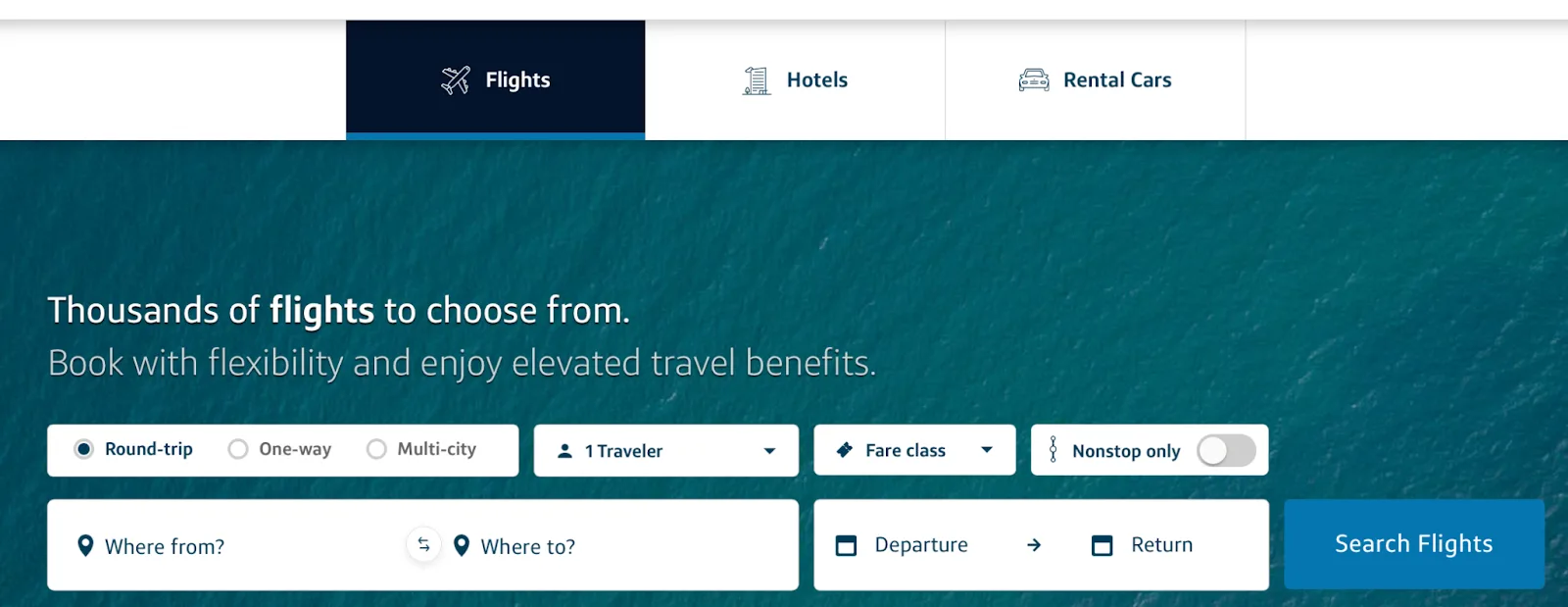 Screenshot of the Capital One Travel homepage on the Flights tab with the tagline 'Thousands of flights to choose from'