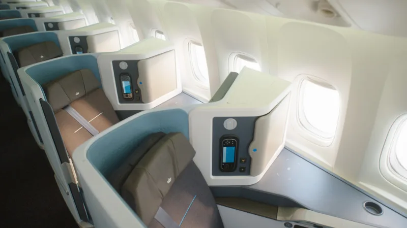KLM World Business Class cabin with Delft Blue touches, illustrating how to fly KLM business class for less.