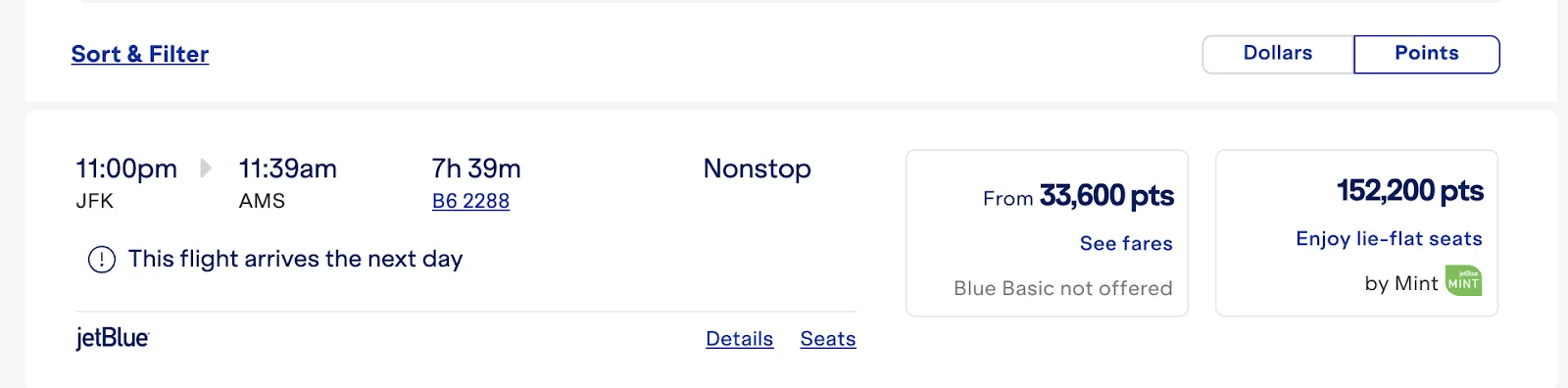 Screenshot of a JetBlue fare search for a nonstop New York to Amsterdam flight, showing fares from 33,600 points and Mint from 152,200 points.
