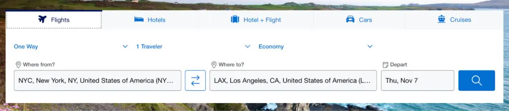 American Express Travel search panel for a one-way New York to Los Angeles flight, displayed over a coastal photo background