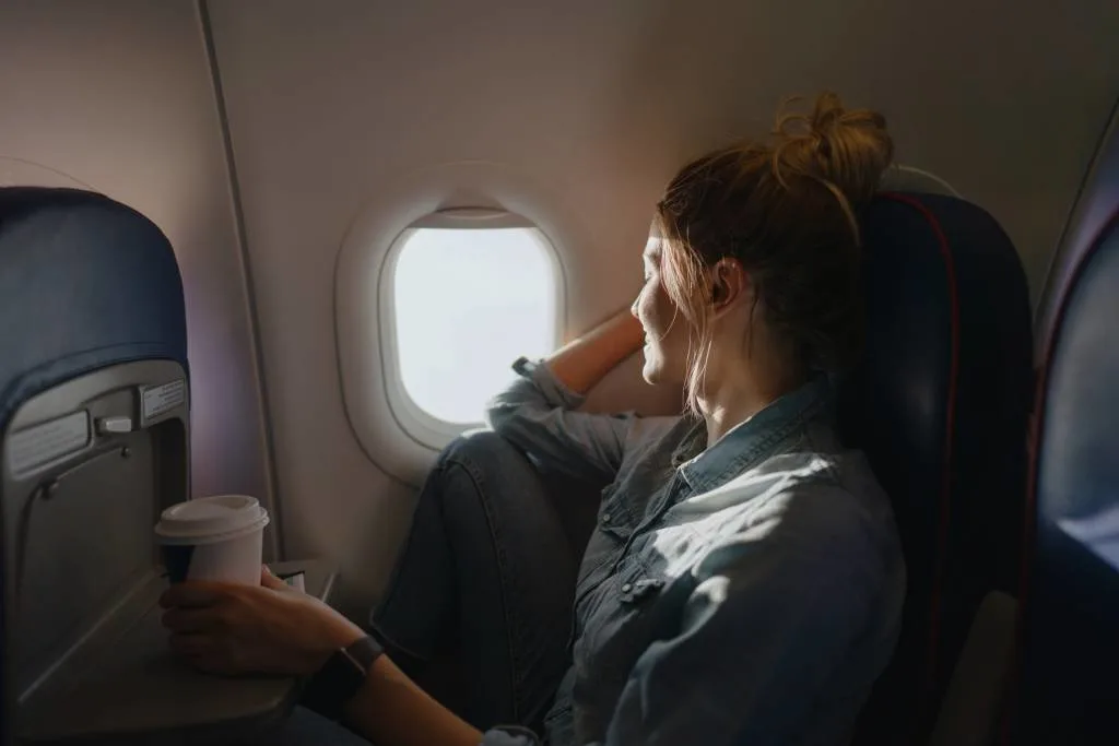 A traveler boarding a flight, illustrating how to maximize airline miles for award travel.