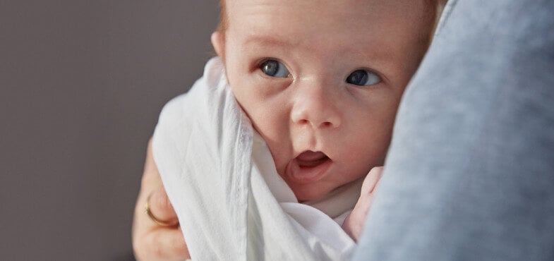 newborn baby lying down