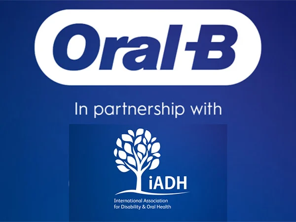 A blue and white graphic with a text graphic that says "Oral-B. In partnership with IADH."