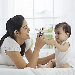 Woman playing with a baby