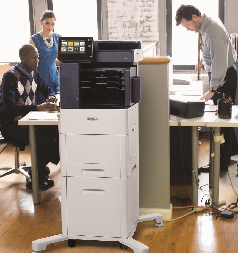 Office workers around a Xerox VersaLink MFP