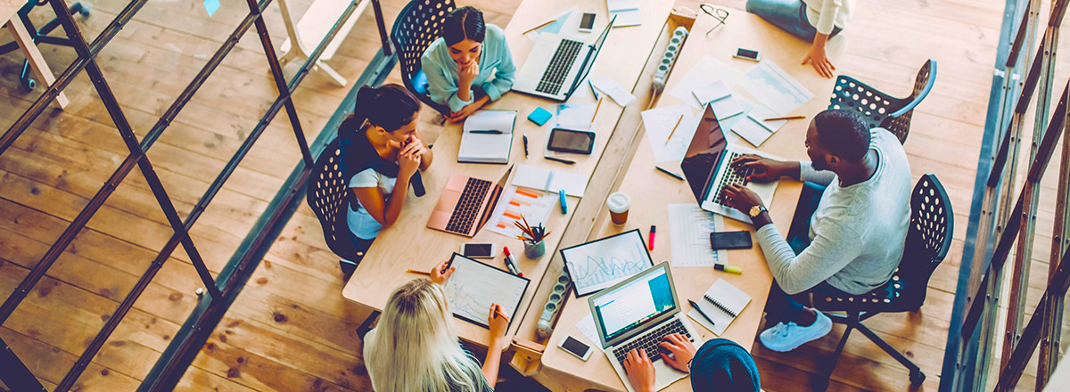 people using computers at a desk