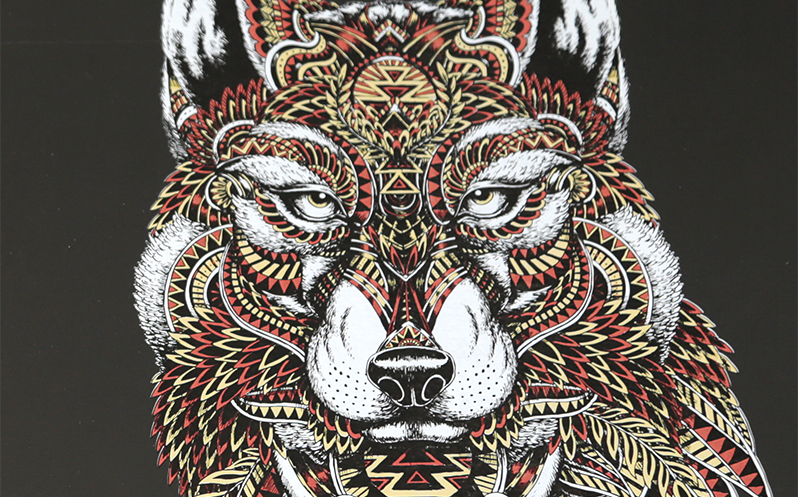 Stylized image of a wolf with gold metallic ink