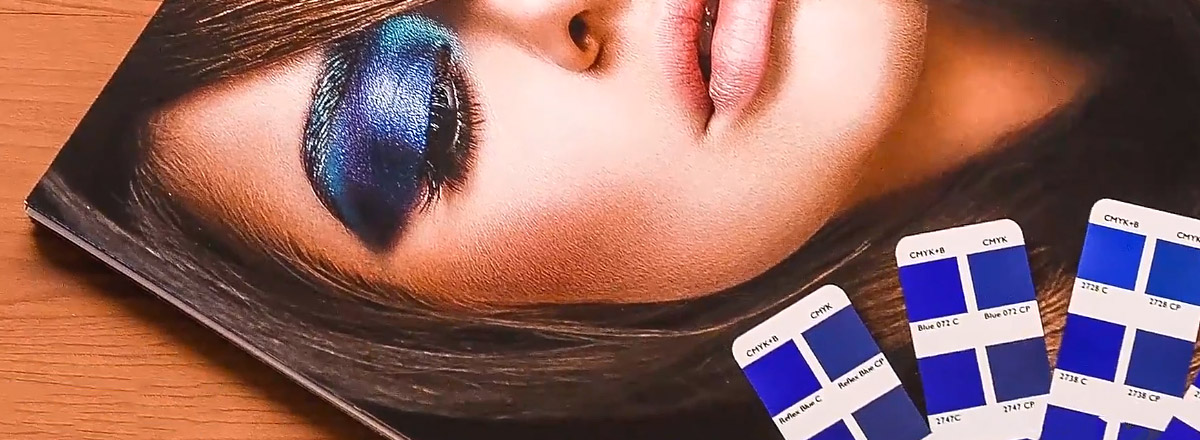 Photo of a model with dark blue eye shadow, next to blue color swatches